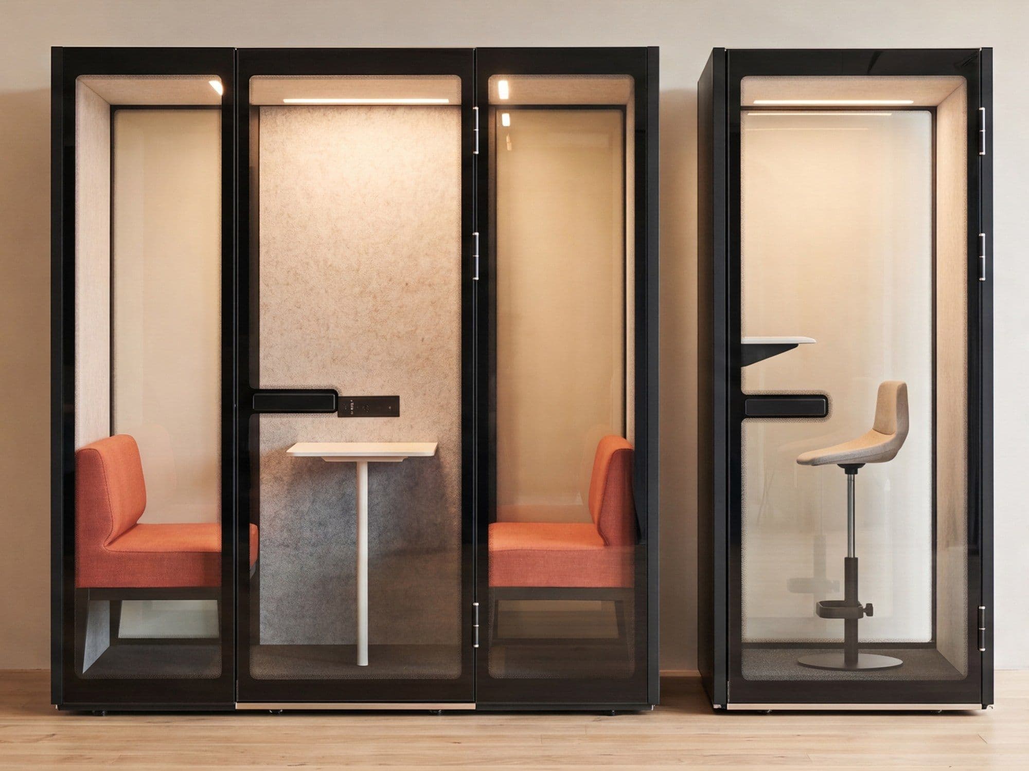 Two Peacepods in a warmly lit office interior